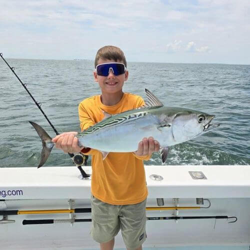 Boy holding false albcore OBX