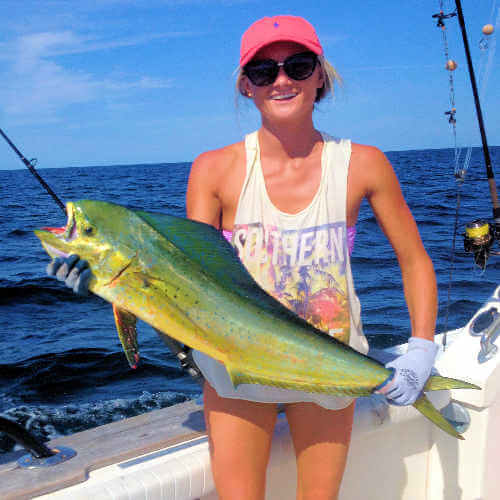Young lady holding mahi on Outer Banks charter.